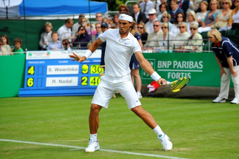 Rafael Nadal in action against Stanislas Wawrinka during the BNP Paribas Fortis Tennis Classic at the Hurlingham Club, London.