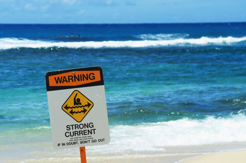 Strong current warning sign at Poipu Beach Park Kauai HI