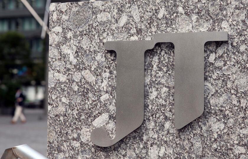 A picture taken on Oct.10, 2018 shows a Company Logo of Japan Tobacco Inc. in front of its Head office in Minato, Tokyo.( The Yomiuri Shimbun via AP Images )