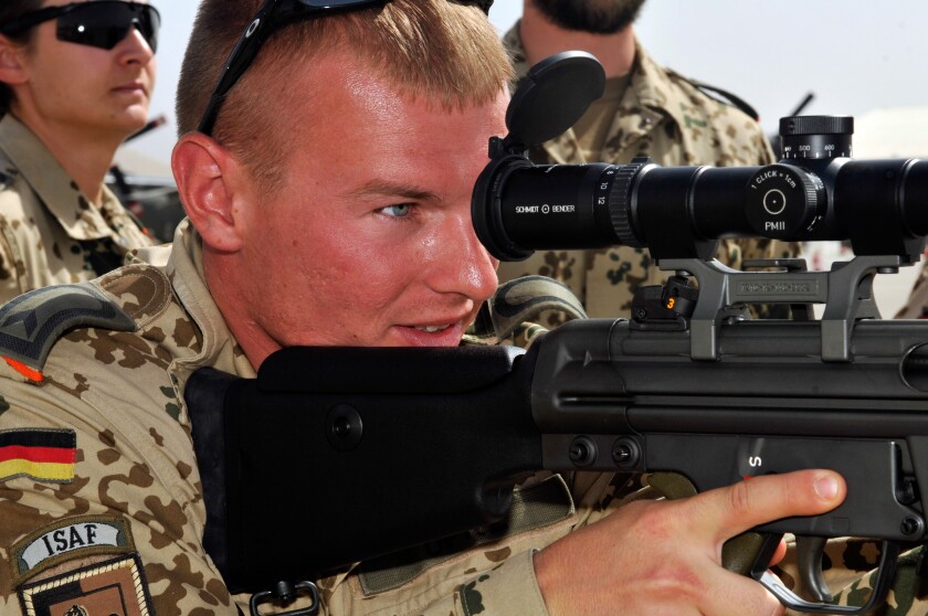 A German soldier assigned to the International Security Assistance Force (ISAF), holds a G3A3ZF rifle with a Hensoldt 4x24 opti
