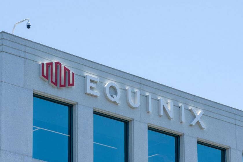 Close up of Equinix logo sign on the building at its headquarters in Redwood City, California, USA.