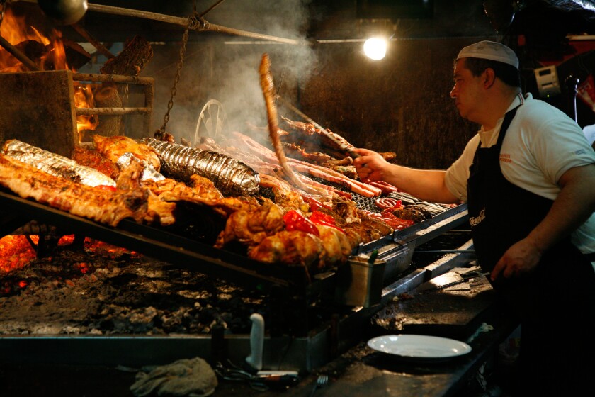 Meats cooked over wood barbecues at the Mercado del Puerto, Montevideo, Uruguay.