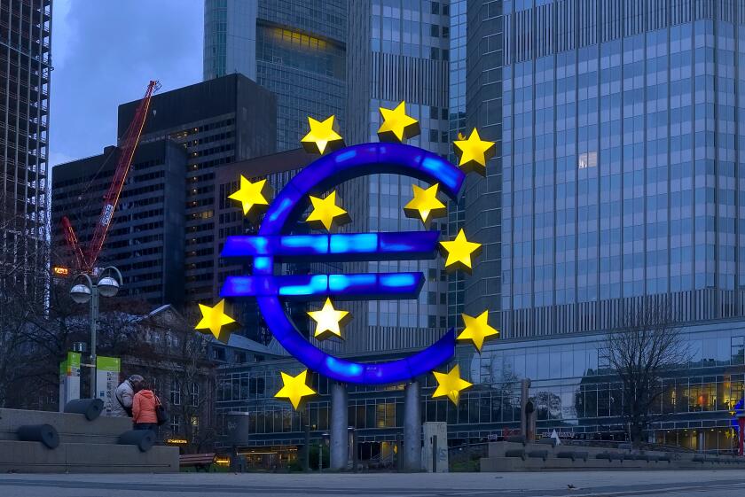 Euro sculpture in front of Eurotower, European Central Bank Building, Frankfurt, Germany, Europe
 
 Photo © Fabio Mazzarella/Sintesi/Alamy Stock Photo