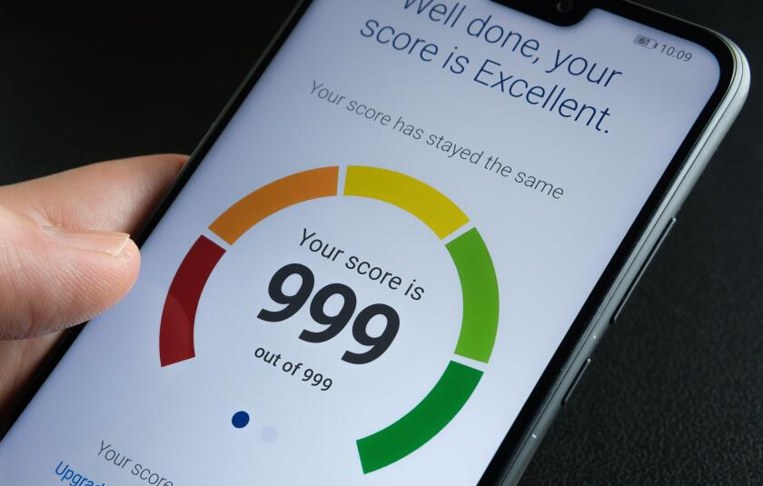 Stafford / United Kingdom - September 27 2020: Experian Credit Score report seen in the smartphone screen with the highest possible number. Real photo