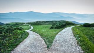 landscape of a fork in the road at storm weather, concept of insecurity of future