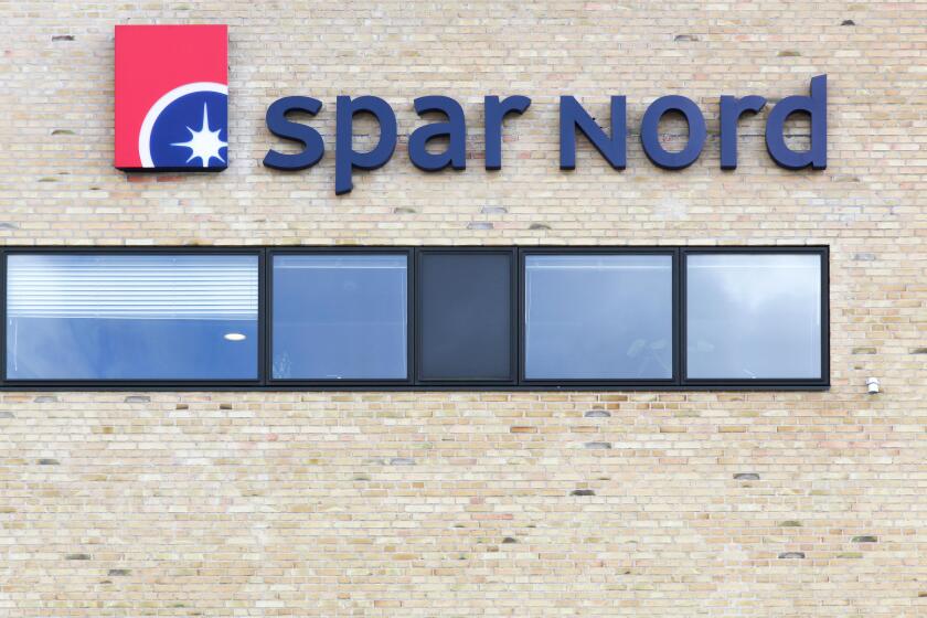 Aalborg, Denmark - July 13, 2017: Spar Nord logo on a wall. Spar Nord is a bank based in North Jutland, Denmark