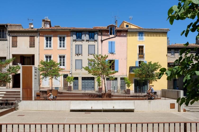 Colourful French houses beside the Cathedral Saint - Michel in Carcassonne, France.
