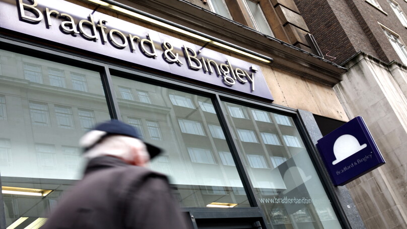 Commuters pass by a branch of Bradford & Bingley in central London, United Kingdom in 2009.