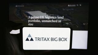 Stuttgart, Germany, 05-29-2024: Person holding cellphone with logo of British property company Tritax Big Box REIT plc in front of business webpage. F
