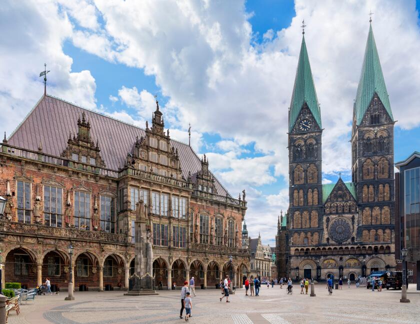The Marktplatz with the Town Hall (Rathaus) to the left and Cathedral to the right, Bremen, Germany