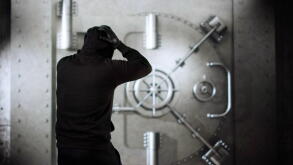 Upset Bank Robber In Trouble Standing In Front Of Locked Vault Door Hearing Siren