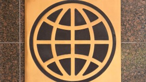 Logo sign of the UN World Bank Group on a granite wall outside a Washington DC office building