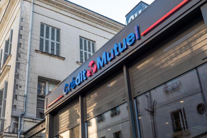 A view of Credit Mutuel Bank front store facade view with logo and signage