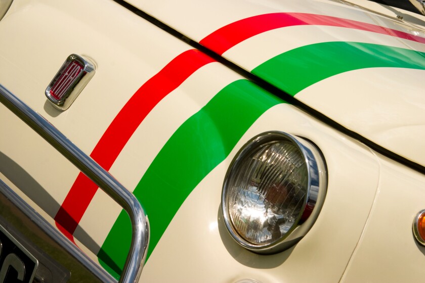 Headlight and badge of Fiat 500 with Italian stripes