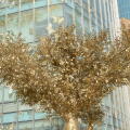 A giant golden tree decorates the outside of a shopping centre in Shanghai, China. 26th Nov, 2023. (Photo by ChinaImages/Sipa USA) Credit: Sipa US/Alamy Live News