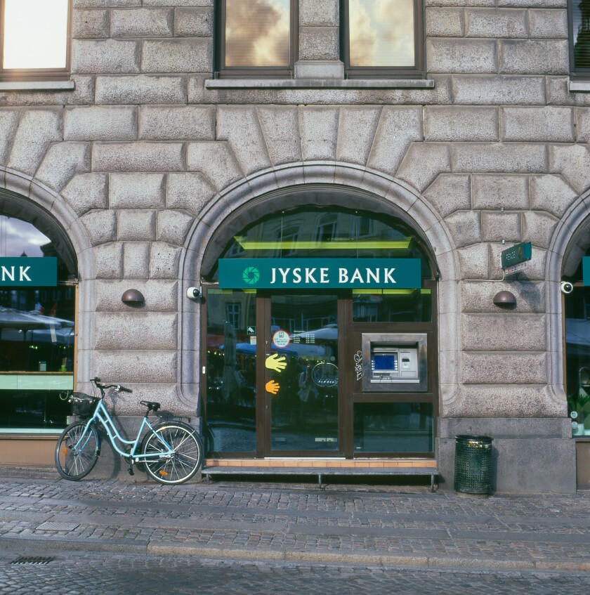 Bicycle parked by ATM Jyske Bank Copenhagen Denmark. Image shot 08/2009. Exact date unknown.