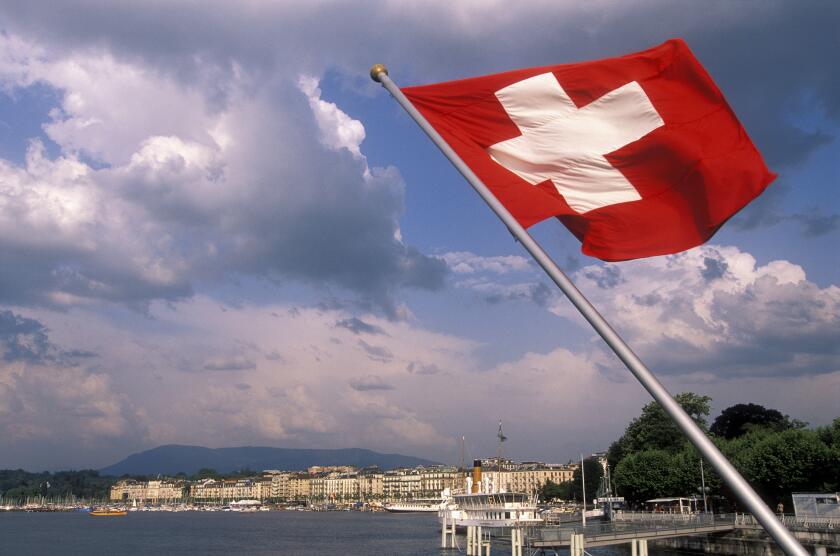 Swiss flag and Lake Geneva, Geneva, Switzerland
