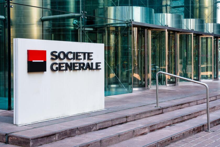 Sign of the Societe Generale at the entrance of the head office of the french banking group in La Defense business district.
