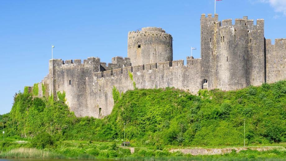 Pembroke castle wall and moat Pembroke Pembrokeshire Wales UK GB Europe - Castell Penfro