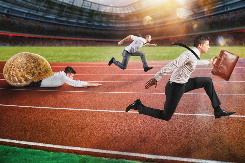 Businessman wins against a competitor slow like a snail