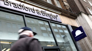 Commuters pass by a branch of Bradford & Bingley in central London, United Kingdom in 2009.