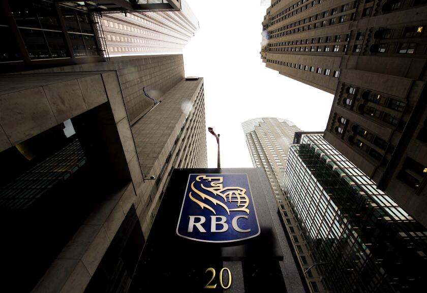 A Royal Bank of Canada sign is shown in the financial district in Toronto on August 22, 2017. Royal Bank of Canada is denying a report in the New York Times that it was able to read, write and delete users' messages on the social networking website Facebo