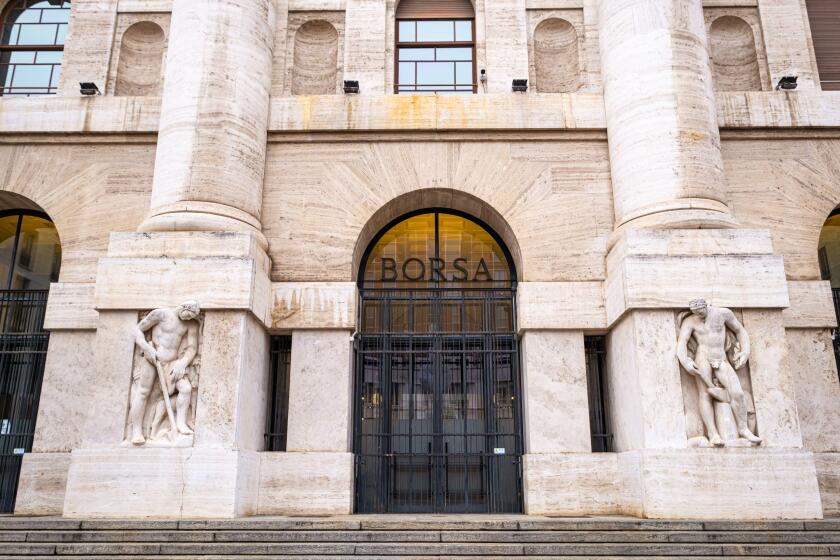 Milan Stock Exchange entrance on Piazza Affari - The building shows the typical fascist style and today is an important landmark in Milano