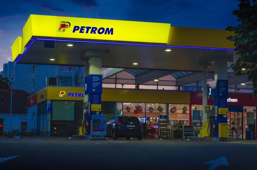 Bucharest, Romania - June 22, 2022: A Petrom gas station is seen at night in Bucharest Editorial stock photo - stock image