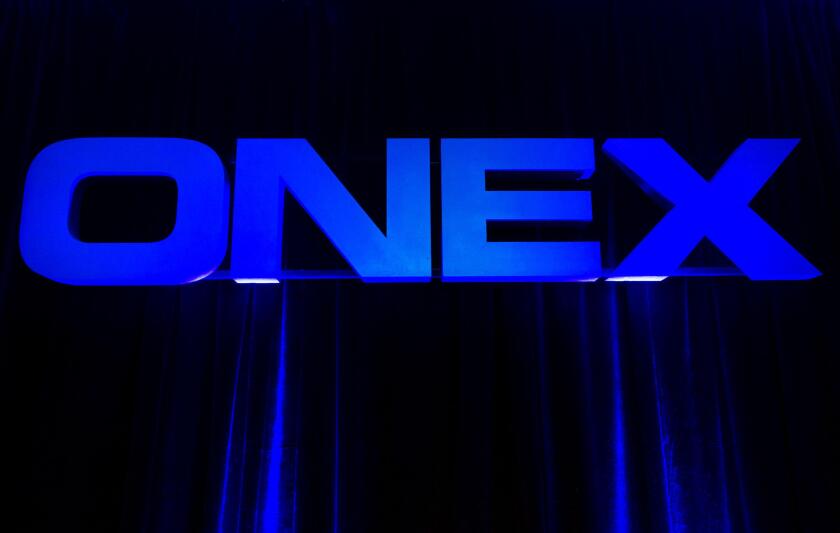 Onex Corp. is reporting an earnings loss in its second quarter after its investments slipped in value. The Onex Corporation logo is displayed at the company's annual general meeting in Toronto on Thursday, May 10, 2012. THE CANADIAN PRESS/Nathan Denette