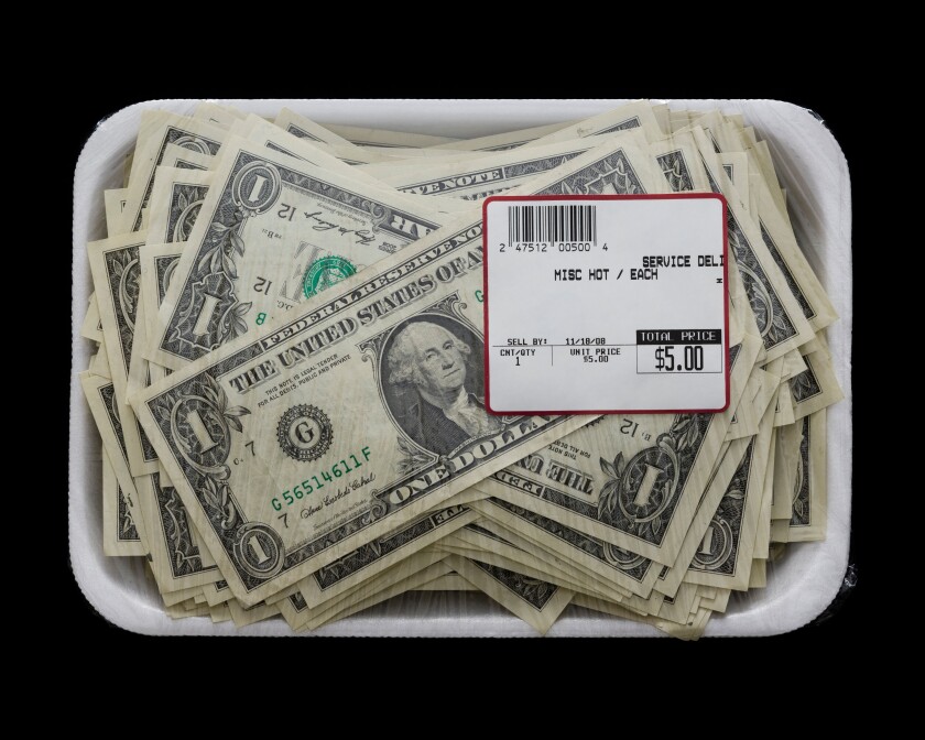 us dollars in a supermarket shrinkwrap package