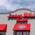 Oshkosh, WI - 25 July 2020:  A storefront sign of Jersey Mikes subs since 1956