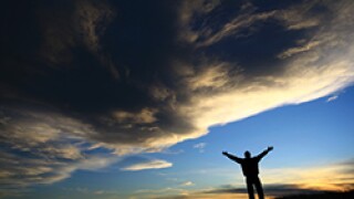 Man and dark clouds