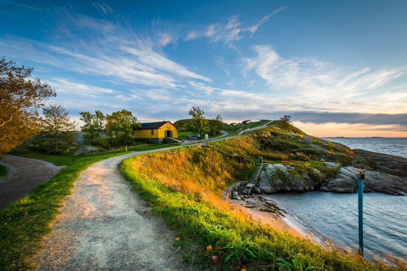 Walkway on bluffs above the Baltic Sea on Suomenlinna, in Helsinki, Finland.