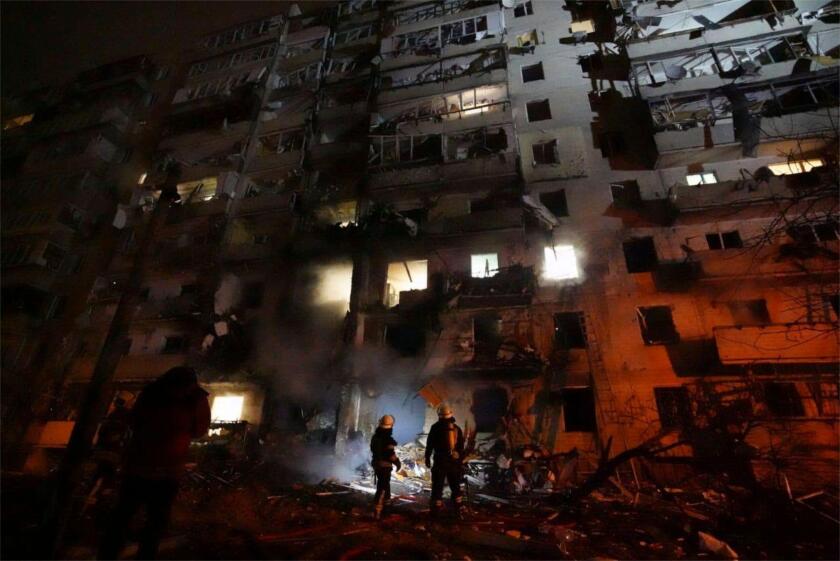 Kiev, Ukraine. 24th Feb, 2022. Ukrainian firefighters respond to the a rocket attack on a residential building attacked by Russian military forces during the invasion February 25, 2022 near Kiev, Ukraine. Credit: State Emergency Service of Ukraine/State E
