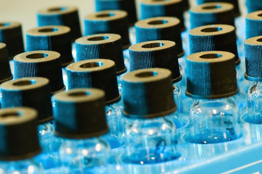 Edmonton, Alberta, Canada; Small Glass Bottles With Black Lids In A Labratory