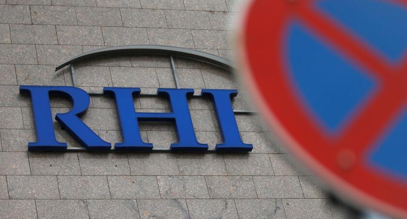 The logo of Austrian specialised fireproof materials maker RHI is pictured behind a traffic sign at an office park building where its headquarters are located in Vienna, Austria October 6, 2016. REUTERS/Heinz-Peter Bader