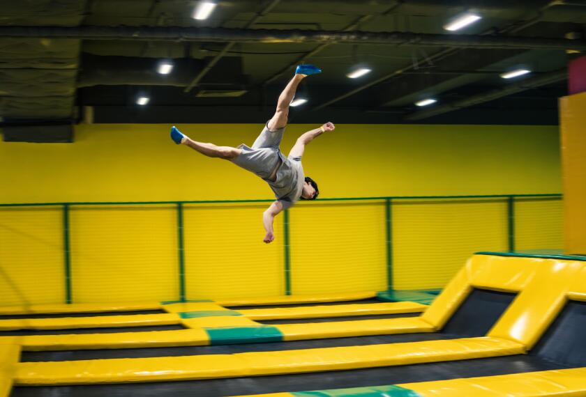 trampoline jumper performs acrobatic exercises on the trampoline