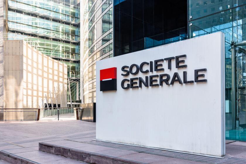 Sign of the Societe Generale at the entrance of the head office of the french banking group in La Defense business district.