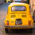 Two classic Fiat 500 cars parked on Trastevere backstreet, Rome, Lazio, Italy.