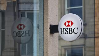 HUDDERSFIELD, UK - JULY 10, 2016: HSBC bank branch in Huddersfield, UK. HSBC is one of largest bank groups, holding assets of USD 2.69 trillion worldw