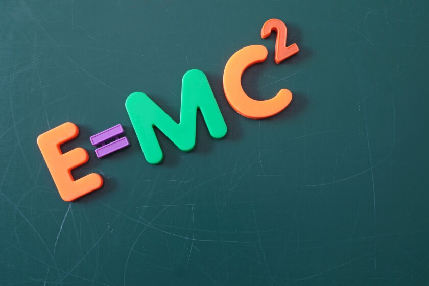The famous theory of relativity shown on a chalkboard symbolizes education.