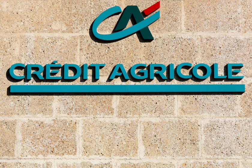 Credit Agricole logo on a wall