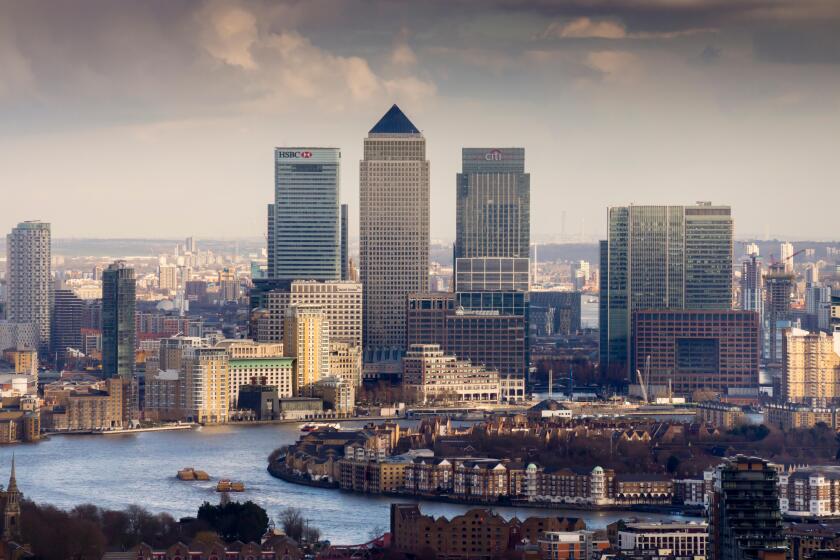 Moody view of Canary Wharf, Docklands, from above, London, UK