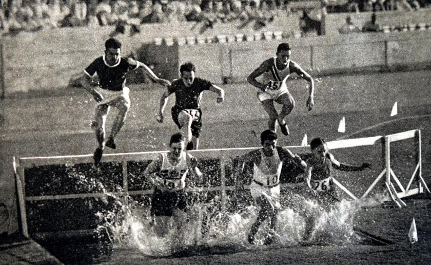 Photograph of the 3000 Meter Steeplechase during the 1932 Olympic games. Won by Volmari Iso-Hollo (1907 - 1969) from Finland. Volmari was one of the last Flying Finns who dominated long distance running. Volmari broke the world record at 09.09.4.