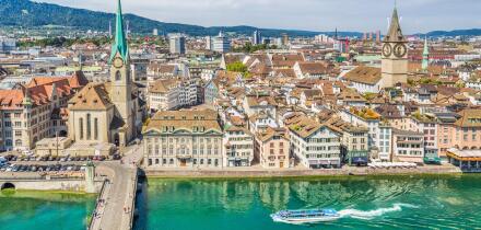 Aerial view of Zurich city center with famous Fraumunster and Sankt Peter Churches and river Limmat at Lake Zurich seen from Grossmunster, Switzerland