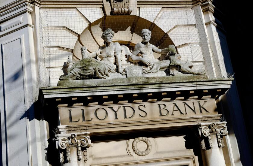 lloyds bank sign carved in stone on old period style building