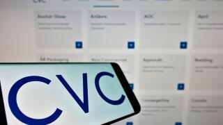 Smartphone with logo of private equity company CVC Capital Partners on screen in front of business website. Focus on center-left of phone display.