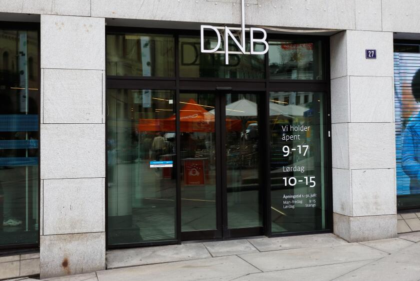 Oslo, Norway - June 20, 2019: Exterior view of the DNB bank office entrance at the 27 Karl Johans gate situated in the downtown district.