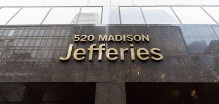Jefferies Group LLC headquarters entrance sign at 520 Madison Avenue, Midtown Manhattan, New York City, USA