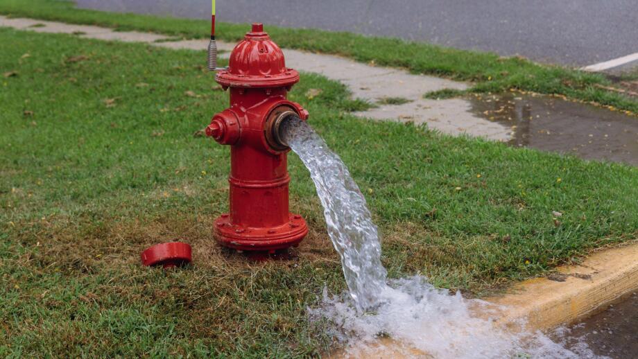 Open in industrial fire hydrant being sprayed strong water